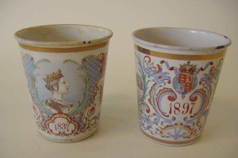 2 Queen Victoria Enamel Anniversary Beaker Cups: 2 Enamel anniversary beaker cups commemorating Queen Victoria's 60 year reign, 1837-1897. Different motif on the cups. Each measuring 3.75" high and 3-3/8" in diameter.