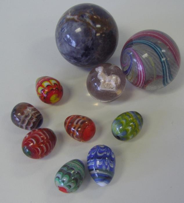 Vintage Marble Collection, Sulfide Sheep, Orb, Egg: Vintage marble collection comprised of 7 egg-shaped glass marbles, a sulfide marble with a sheep, a large swirl glass marble measuring 2" in diameter and a marble orb measuring 2.25" in diameter. Come