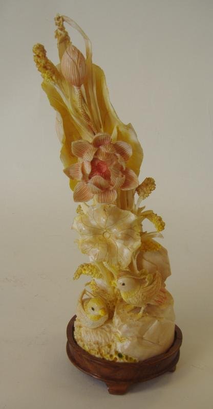 Chinese Carved Ivory Polychrome Tusk Sculpture: Exceptionally well carved Chinese polychrome ivory tusk. The carving depicts two birds perched on rockery among florals. Fitted into a wood stand. Overall measurement, 11.5" high.