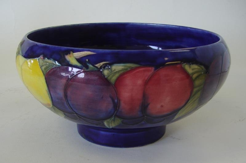 William Moorcroft Pottery Bowl, Wisteria: William Moorcroft pottery bowl in the Wisteria pattern. c.1920s. Measures 8.5" in diameter and 4.25" high. NOTE: star hairline showing on the underside. See photos.
