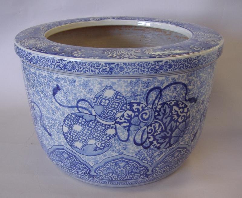 19thc Japanese Imari Jardiniere Hibachi: Japanese blue and white imari jardiniere or hibachi, 19th century. Decorated with gourd, phoenix, chrysanthemum and karakusa motifs. Measures 17.75" in diameter and 11.75" high.