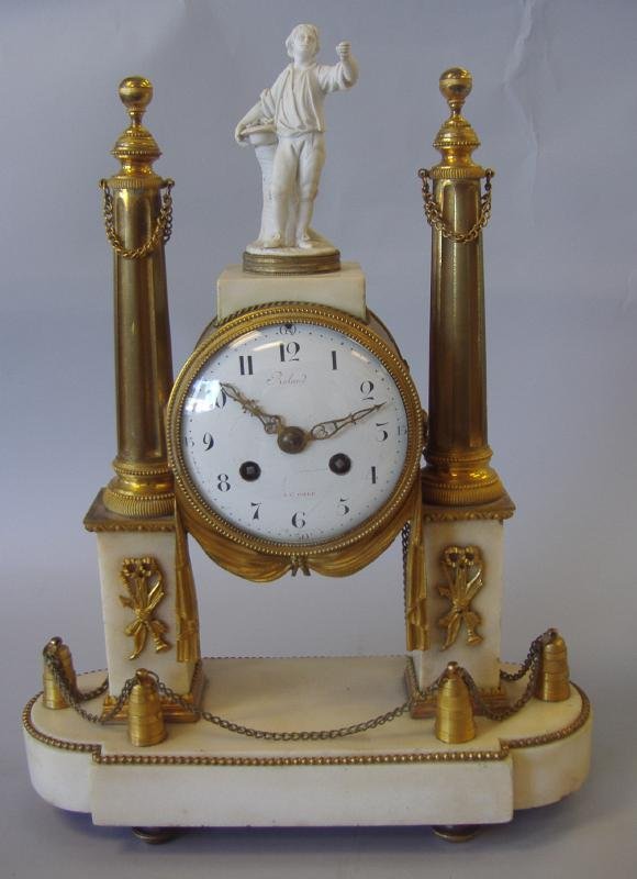 French Gilt Bronze & Marble Clock, L. Marti et Cie: French gilt bronze and marble clock with a parian figure of a young man with flowers. The movement is by L. Marti et cie, dated 1889, Medaille D'Argent. Measures 17.5" high, 12.75" wide and 5" deep. N