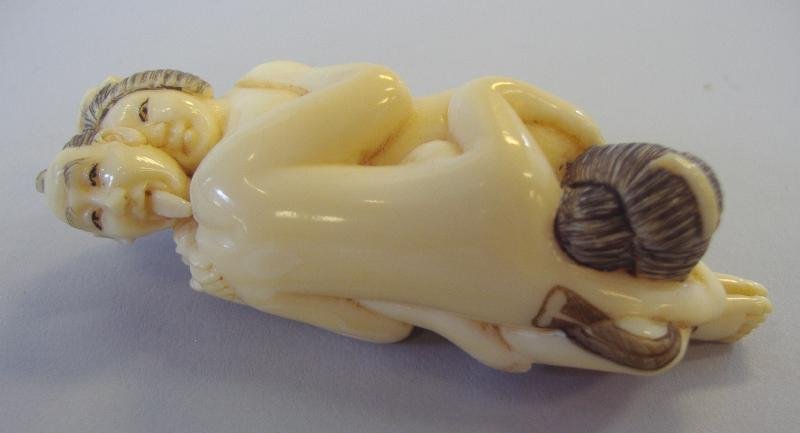 Japanese Ivory Erotic Netsuke, 3 Figure, signed: Japanese carved polychrome ivory erotic netsuke. Measures 2.5" long and 1" wide. NOTE: Ivory only shipped to US addresses.