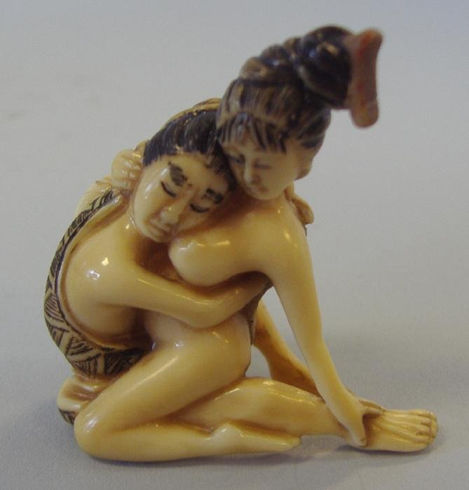 Japanese Ivory Erotic Netsuke, 2 Figure, Signed: Japanese carved polychrome ivory erotic netsuke. Measures 1.75" high, 1.5" long and .75" wide. NOTE: Ivory only shipped to US addresses.