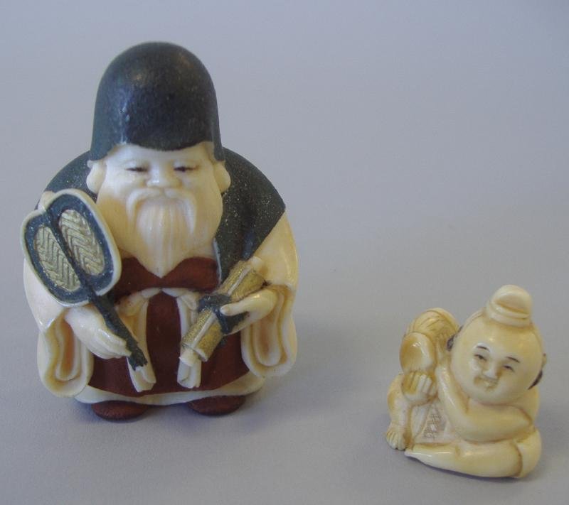 Two Ivory Netsukes, Both Signed: Polychrome ivory netsuke of an Elder or Scholar measuring 2" tall. Together with a carved ivory netsuke of a young male. Measures 1" high. NOTE: Ivory only shipped to US addresses.