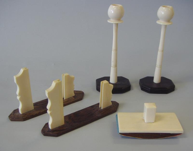 African Ivory Candlesticks, Frames & Blotter: Vintage African ivory candlesticks measuring 7.75" high, together with a roller blotter and two picture frame holders. NOTE: Ivory only shipped to US addresses.