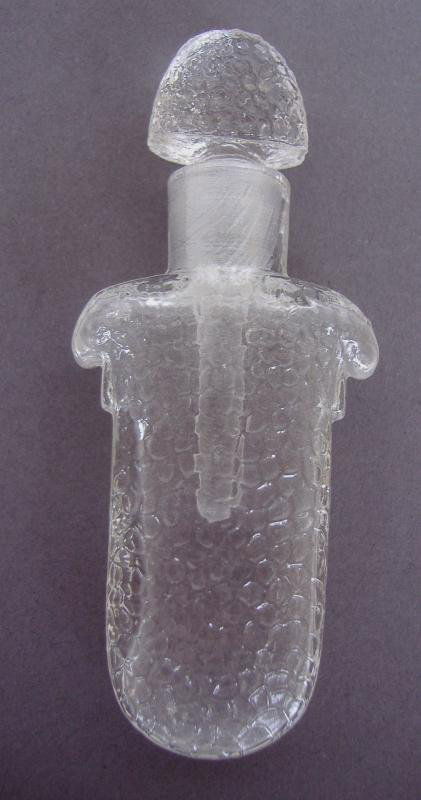 Caron Narcisse Noir Perfume Scent Bottle: Art Nouveau perfume glass scent bottle measuring 3.25" long. Comes with the original pouch with label reading "Magnum of Narcisse Noir, Contents made by Caron, Paris".