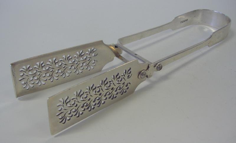 Sterling Silver Asparagus Tongs, Mary Chawner 1835: William IV sterling silver asparagus tongs. Hallmarked, London, 1835, Mary Chawner. Measures 10.5" long. Weighs 6.5 troy oz. Estate of RMS.