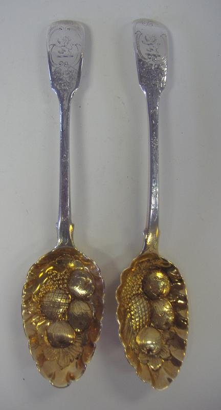 Pair of Sterling Silver Berry Spoons, London, 1824: Pair of George IV sterling silver berry spoons. Gold wash bowl. Hallmarked for London, 1824, William Chawner II. Lion crested on the handle. Etched floral and swag motif front and back of the stem. Ea