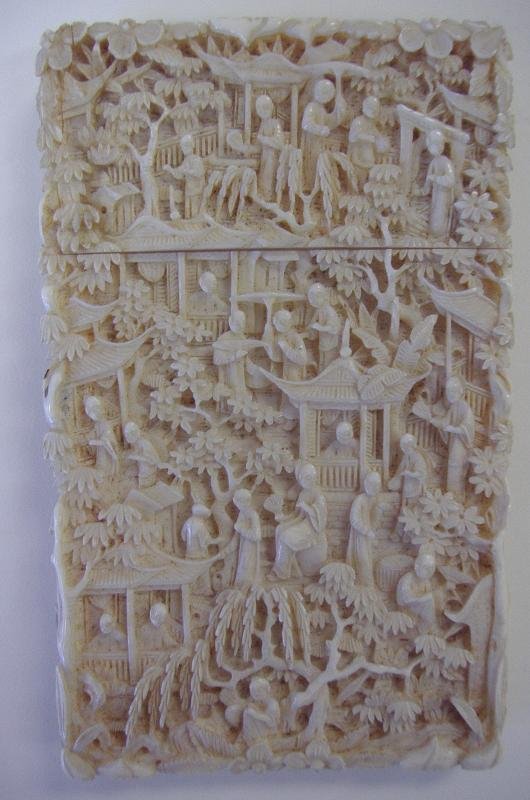 Antique Chinese Carved Ivory Card Case, Signed: Chinese carved ivory card case. 19th century. High relief carvings on all sides. Measures 4-1/8" high, 2.5" wide and 1/2" thick. Signed on the inside. NOTE: small crack line on one corner of the lid, 