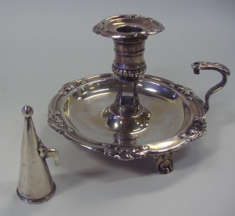 Sheffield Sterling Silver Chamberstick & Snuffer: Sterling silver chamberstick with original candle snuffer. Hallmarks for Sheffield, England, 1813, WC. Young & Company, Measures 6" in diameter and 4.5" high. Overall weight, 317 grams.