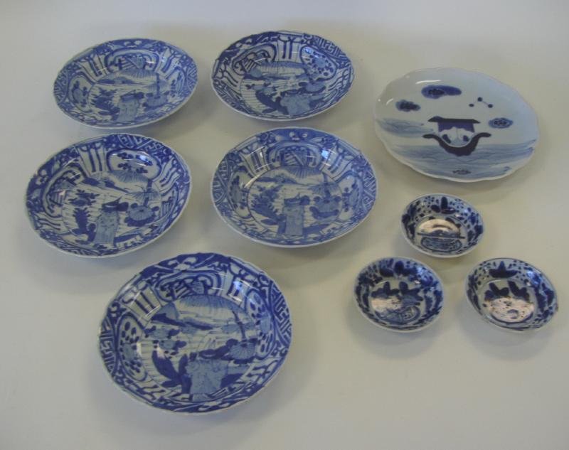 9 Chinese & Japanese Porcelain Dishes: Blue and white porcelain. Comprised of three small Chinese dishes measuring 3.5" in diameter, together with five Japanese shallow bowls measuring 7" in diameter and 1.5" high and one plate measuring 8