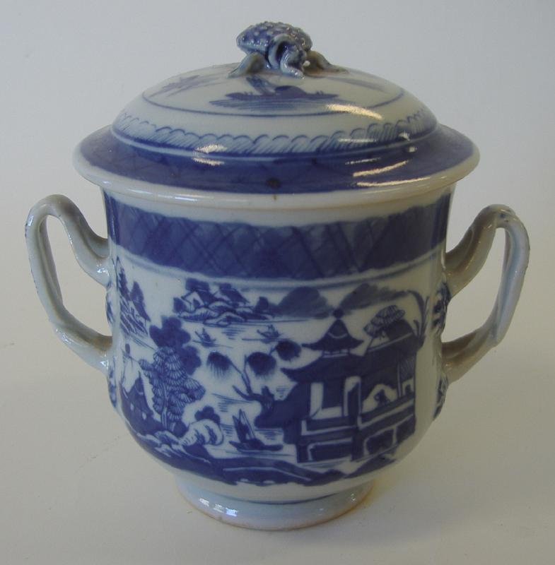 19thc Chinese Canton Porcelain Covered Sugar Bowl: Chinese blue and white porcelain 2-handled covered sugar bowl. 19th century. Canton pattern. Measures 5.5" high and 6" wide from handle to handle. Provenance: Estate of Robert McKay Shields.