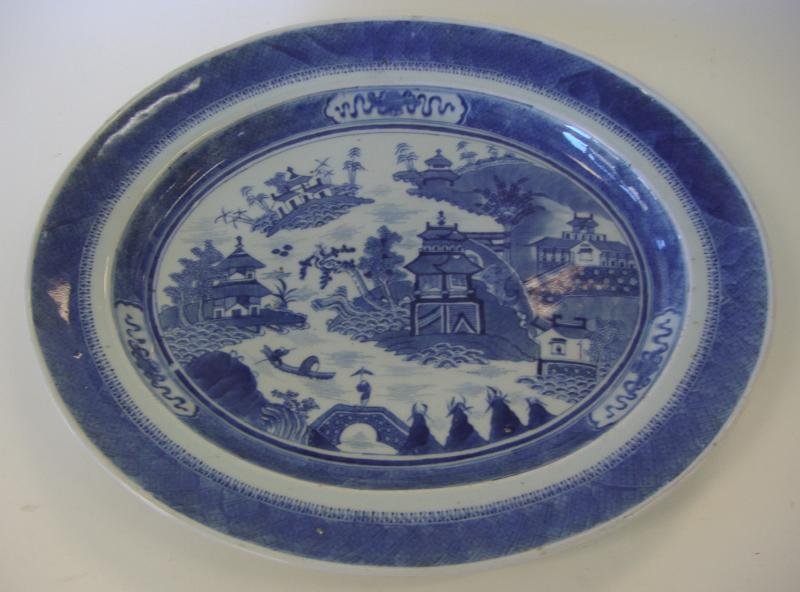 19thc Chinese Nanking Porcelain Oval Platter: Chinese blue and white porcelain oval serving platter. 19th century. Nanking pattern. The platter measures 18.75" x 15-5/8" x 2" high. Provenance: Estate of Robert McKay Shields.