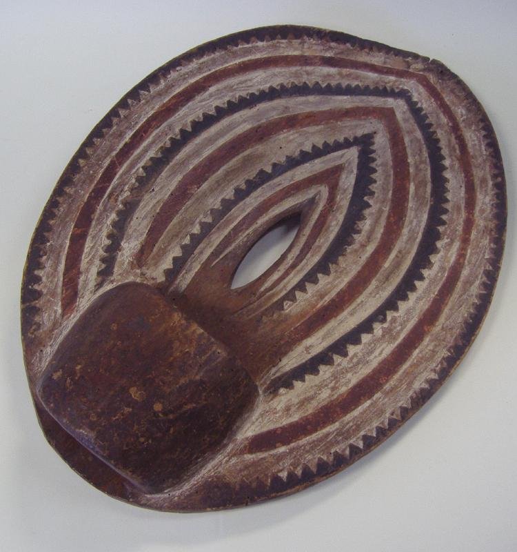 African Polychrome Wood Shield, Kenya Africa: African polychrome painted wood shield. Kenya. Painted on both sides. Measures 22" x 16". Provenance: Estate of Robert McKay Shields.