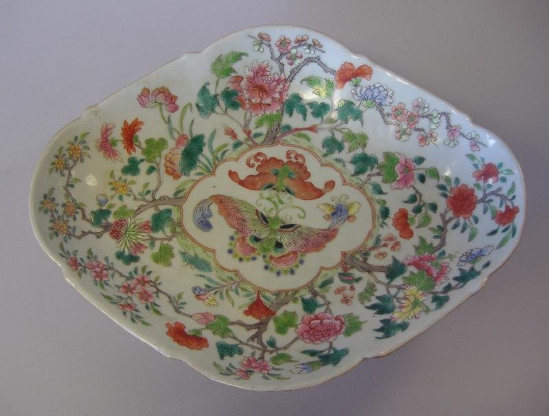 Chinese Porcelain Footed Fruit Bowl, Jiaqing Mark: Chinese porcelain oval footed fruit compote tazza bowl. Signed underfoot with the Jiaqing mark (1796-1820). Decorated in famille rose over-glaze enamels depicting bats and butterflies among florals. M