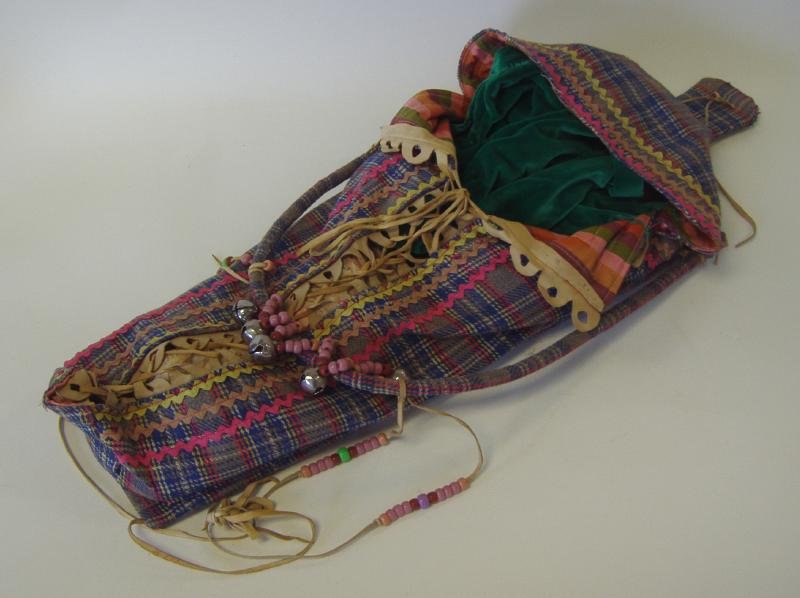 Native American Yakima Indian Cradle Board: Native American Indian cradleboard. Yakima Indians. Fabric cradle detailed with multi-colored beads and bells. Measures 31" x 12".