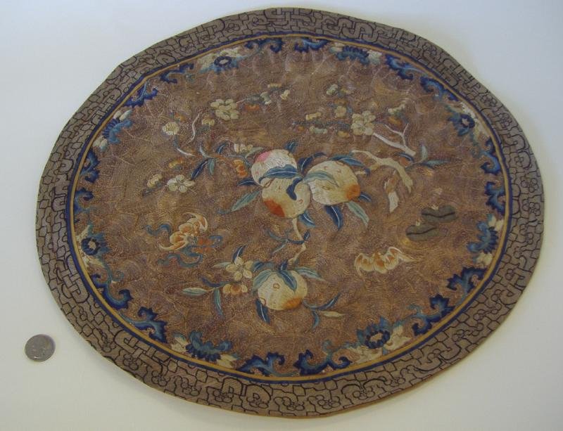 Chinese Embroidered Silk Table Panel Bats, Florals: Round embroidered silk table mat or panel. Gold, white and blue threading depicting fruits, florals and bats. Measures 17.75" in diameter. Ex collection of General Joseph Warren Stilwell (1883-1946).
