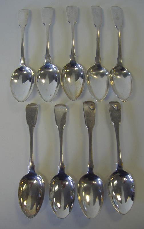 9 Sterling Silver Dessert Spoons, London 1818-1837: English sterling silver assembled set of nine dessert spoons. All hallmarked for London. Six dated 1818, Maker's mark TB (Thomas Barker?), two dated 1837, Maker's mark JW within an oval (Monogram P),