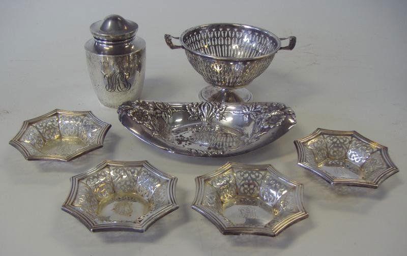 Sterling Silver Table Articles, Tea Caddy Basket +: Sterling silver table articles, comprised of a nut basket, 4 nut dishes, a candy dish and a tea caddy. Overall weight 12.41 troy oz.