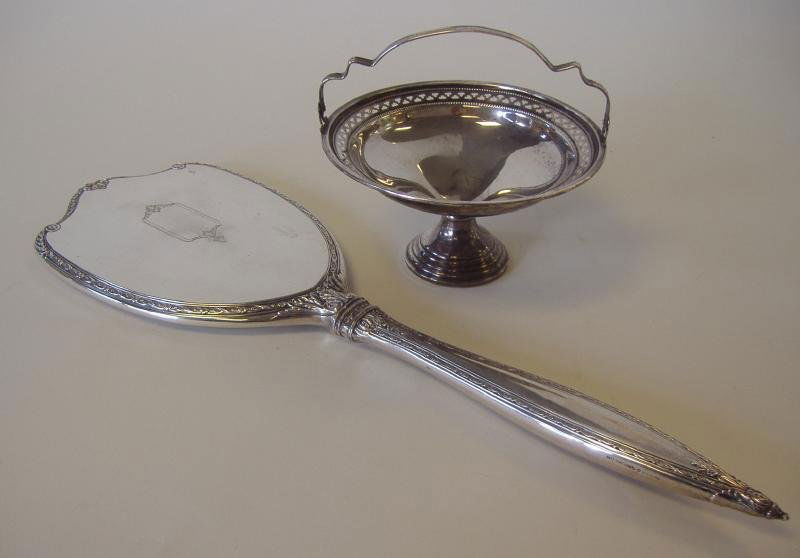 Sterling INTERNATIONAL Hand Mirror & Compote: Sterling silver compote basket by Crosby (weighted), measuring 5.25" in diameter and 4.5" high to top of handle. Together with a large sterling hand mirror by International. The mirror measures 15.75"