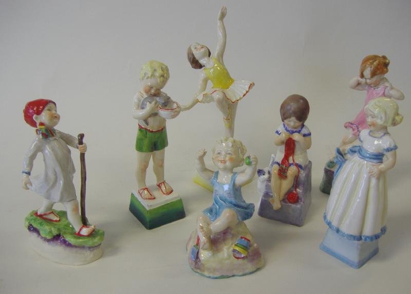 ROYAL WORCESTER Days of the Week Figures, Complete: A complete set of Royal Worcester porcelain figures, modeled as days of the week, each one in the form of a child in a different animated pose. The undersides marked Royal Worcester, England and each 