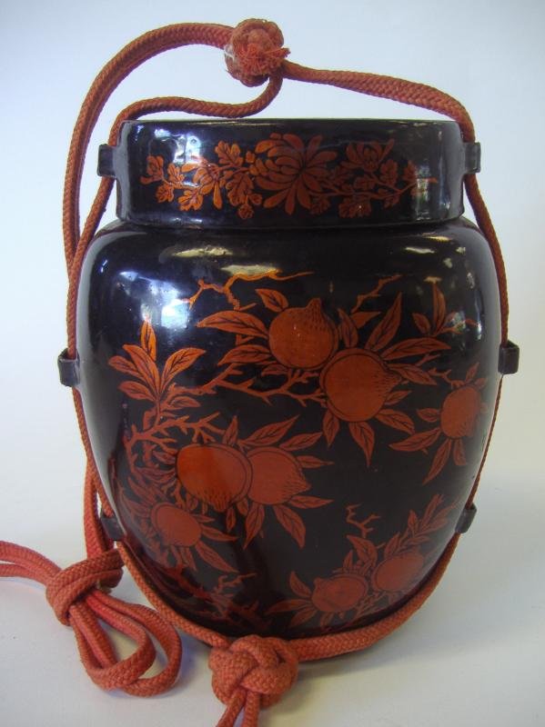 Chinese Lacquer Carry Storage Canister Box: Black lacquer carry storage box or canister. Late 19th/early 20th century. Fruit and floral motif. Measures 8" high, 6" wide and 4.5" deep. Ex collection of General Joseph Warren Stilwell (1883-1946).