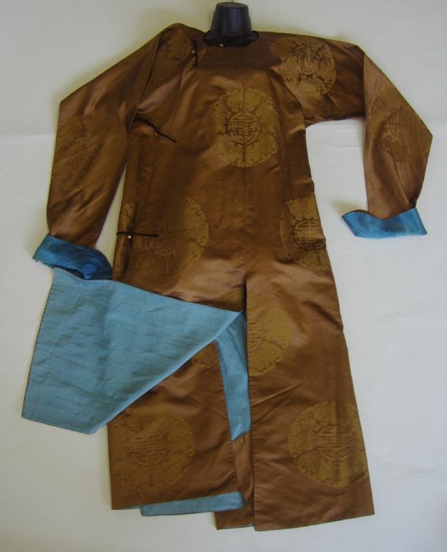CHINESE SILK EMBROIDERED ROBE w/ 5 Bat & Shou Symbol: Chinese brown embroidered silk robe with gold bead-buttons. The robe has stitch embroidery with roundels depicting 5 bats surrounding the Shou symbol for longevity.