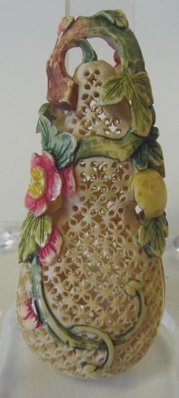 19thc Chinese Polychrome Ivory Pomander: Chinese pierced polychrome ivory pomander. 19th century. Double gourd form. Carved in high relief depicting florals on a leafy branch against a finely pierced brocade ground. Measures 2-7/8" high and 