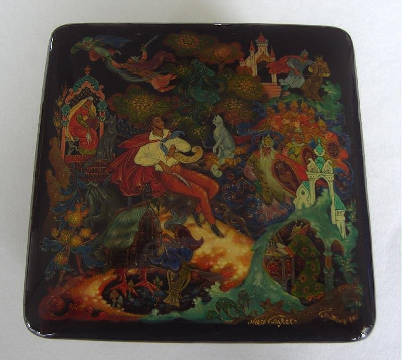 RUSSIAN Lacquer Box, Pushkin's Tales PALEKH SCHOOL: Russian lacquer box, Palekh school. Lukomorya, Pushkin's Tales by Platonov. Artist signed and dated 1987. The box measures 2-3/8" x 2-3/8" x 1.25" high.
