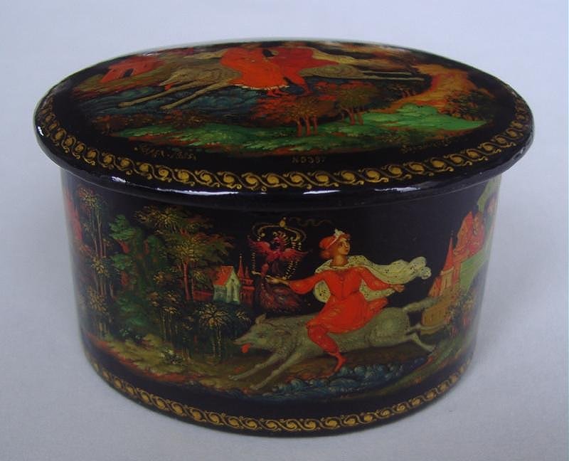 RUSSIAN Lacquer Box, Firebird, PALEKH SCHOOL: Russian lacquer box. Oval shaped. Palekh School. Artist signed. "Firebird" by Zolotareup. Measures 2.25" x 1.75" x 1.25" high.
