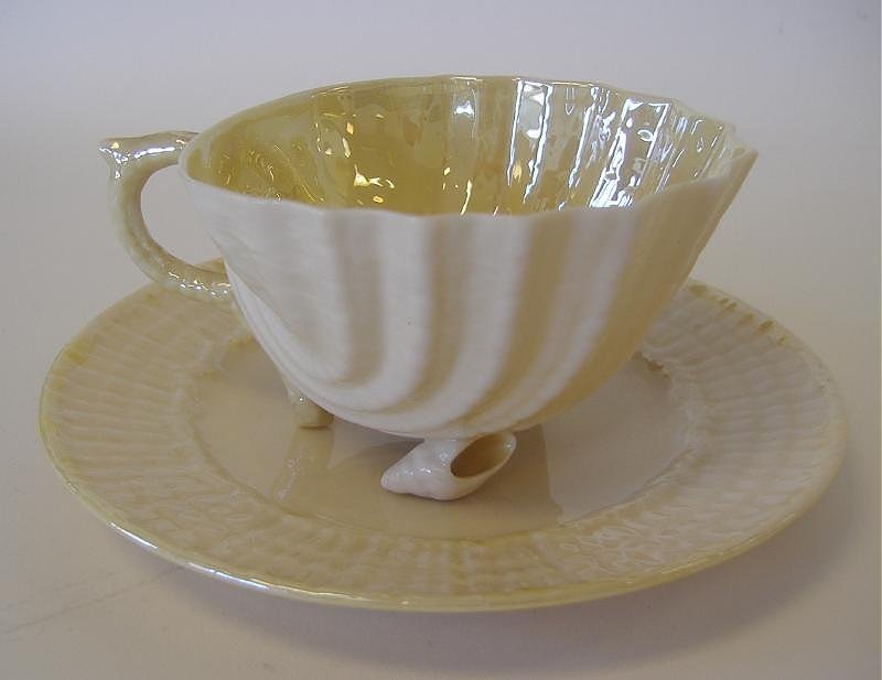 BELLEEK Black Mark Shell Formed Cup & Saucer: The shell formed cup measures 3.5" in diameter and 2-1/8" high. The saucer measures 5.5" in diameter.