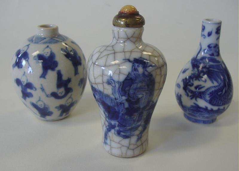 3 Chinese Blue & White Porcelain Snuff Bottles: Three Chinese blue and white porcelain snuff bottles. Late 19th century. The tallest bottle with stopper measures 3.25" high.