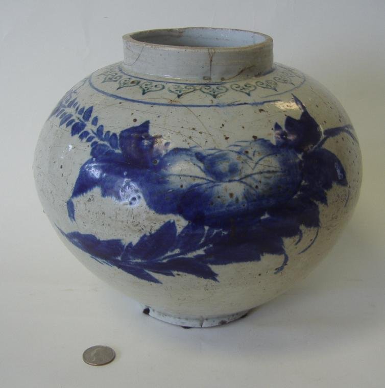 19thc KOREAN Blue & White Porcelain Jar: Floral motif. Measures 8.5" high and 11" in diameter at the widest point on the body. NOTE: Overall glaze / age lines