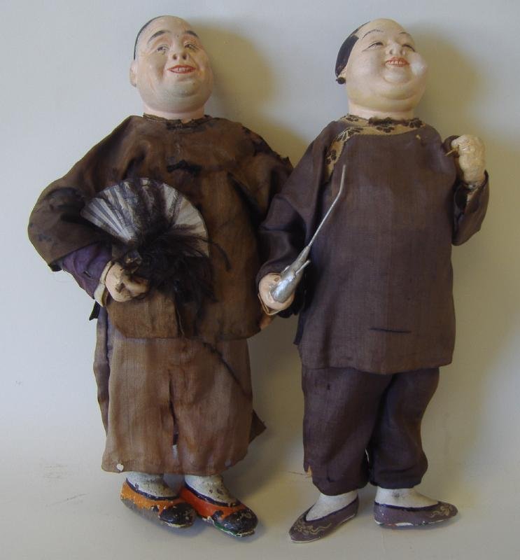 2-19thc Chinese Character Dolls, with Opium Pipe: 2 Chinese theatre or character dolls. 19th century. Hand-painted faces, silk costumes. One holding a fan and one doll with an opium pipe. Each measuring approximately 11.5" tall.