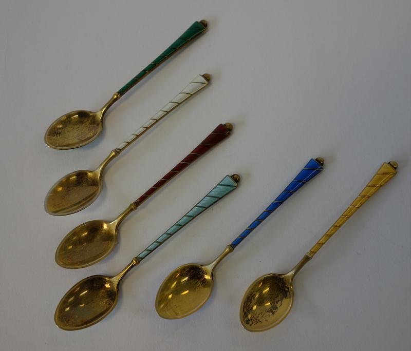 6 Danish Sterling & Enamel Demitasse Spoons & Case: Set of six gold-wash sterling and enamel demitasse spoons. By Egon Lauridsen, Copenhagen, 1936-1966. Marked E.La, Denmark Sterling. Each measuring 3.5" long. With fitted silk lined presentation case.