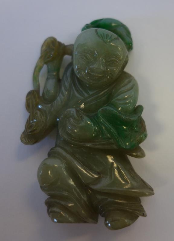 Chinese Carved Jadeite Jade Figure with Rabbit: Chinese jadeite jade figure. Well carved figure of a boy with a rabbit on his head. Measures 2.75" high.