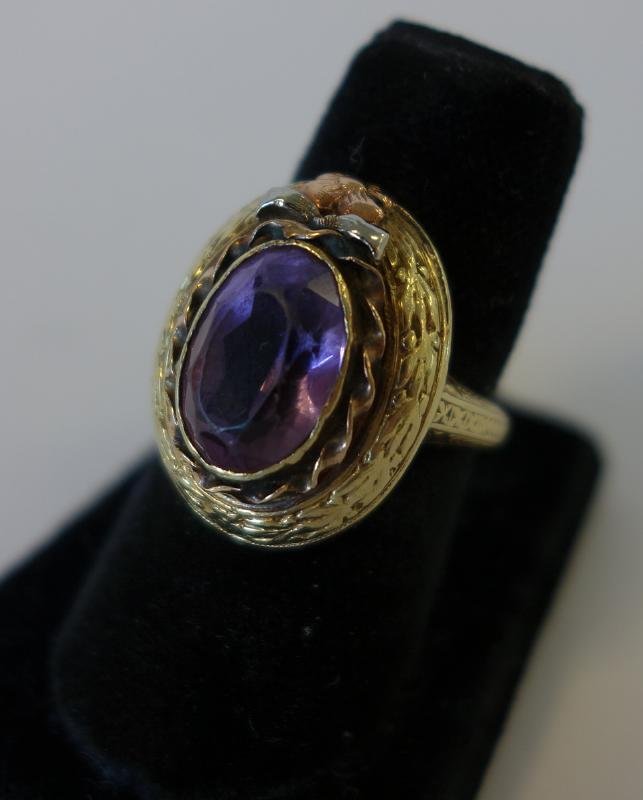 Victorian 14K Gold & Faceted Amethyst Ring: Victorian 14K gold ring set with a faceted amethyst, The ring enhanced with a rose gold flower and a white gold bow. Overall weight 6.8 grams. Ring size 5.75.