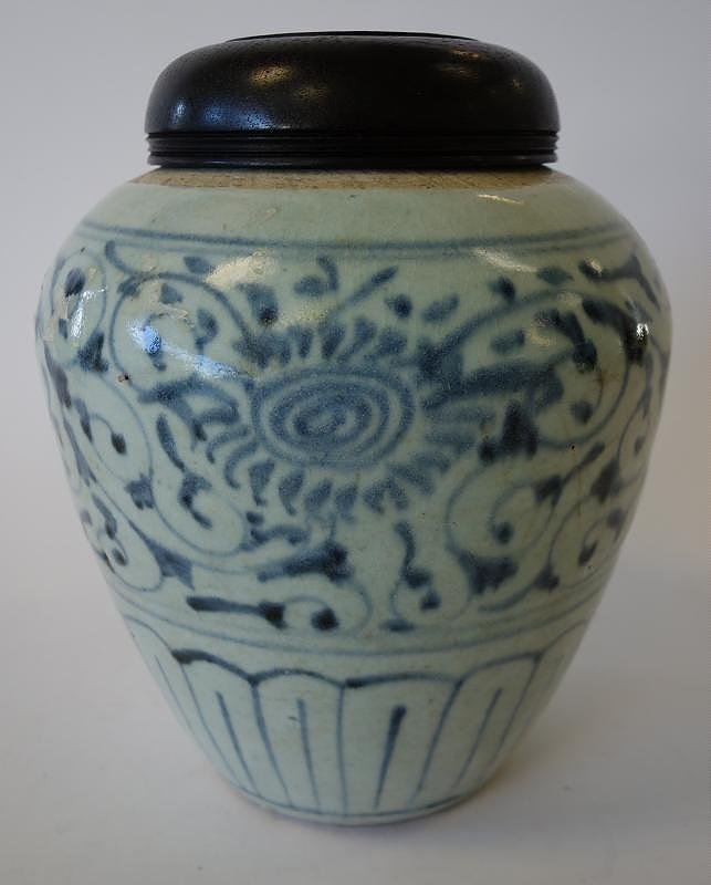 Chinese Porcelain Blue & White Jar, Ming Dynasty: Chinese porcelain jar. Ming Dynasty. Overall underglaze blue floral and swag motif. Measures 8.5" high. Wood lid. NOTE: chips and hairlines to body.