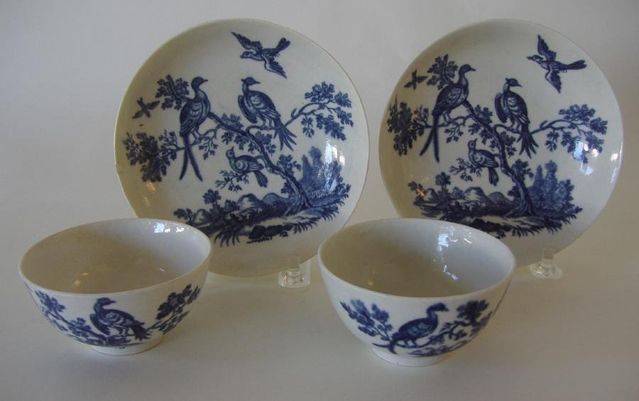 2-18thc Worcester Tea Cups & Saucers Crescent Mark: A pair of Worcester porcelain tea cups with saucers. Dr. Wall period c.1755-1790. Underglazed blue decoration in a bird pattern. The cups measure 3" in diameter, the saucers measure 4-7/8" in diameter