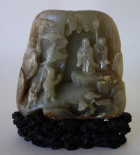 Chinese Carved Jade Boulder: Chinese nephrite jade boulder. Finely carved on both sides. One side depicts figures in a Royal Court procession. The other side depicts deer and bats in a landscape setting of pine trees. Rare