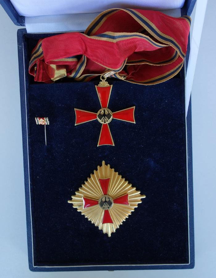 Austrian Decoration of Honor Medals: Decoration of Honor medals. Vienna, Austria. Comprised of a gilt 800 silver medal decorated with a black enameled eagle, centered over a red enameled star. Measures 2-1/8" square. Together with a ribb