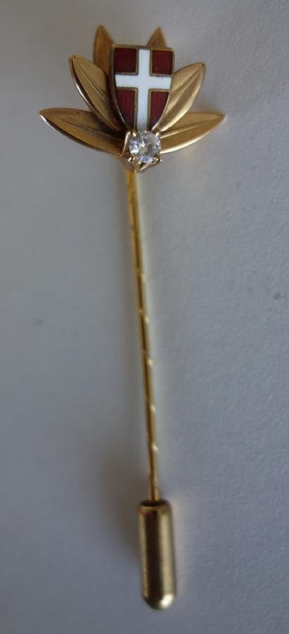Diamond & 14K Gold White Cross Stick Pin: 14K gold stick pin, set with a diamond beneath a red enamel shield with a white enameled cross. Vienna, Austria. Measures 2.25" long. Weighs 3.5 grams. Comes with original presentation case.