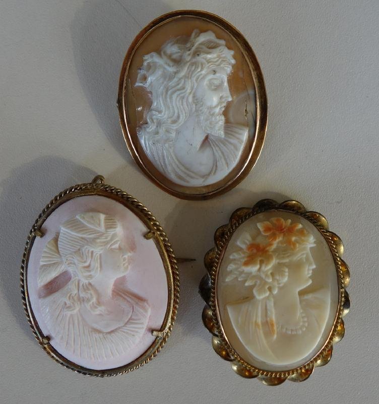 3 Carved Cameos, Jesus plus 2 Young Women: A shell carved cameo depicting Jesus wearing the crown of thorns. Together with two carved cameos depicting female profiles. Each housed in gold - metal frames and measuring approximately 1.5" x 1-1/8