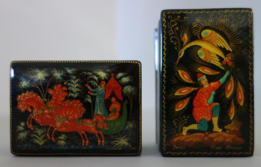 2 Russian Lacquer Boxes, Troika, Palekh School: Two Russian lacquer boxes. Palekh school. Each artist signed. "Troika" by Kuzmenko measuring 2-3/8" x 1.75" x 7/8" high, together with an unidentified title depicting a kneeling male with a bird overh