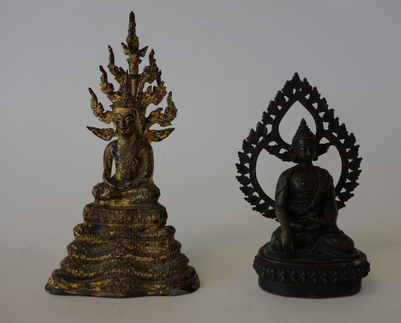 2 Tibetan Bronze Buddha Figures: Two Tibetan figures of Buddha. Gilt bronze model measuring 7.5" high. The bronze Buddha holding a cup in hand measures 6" high.
