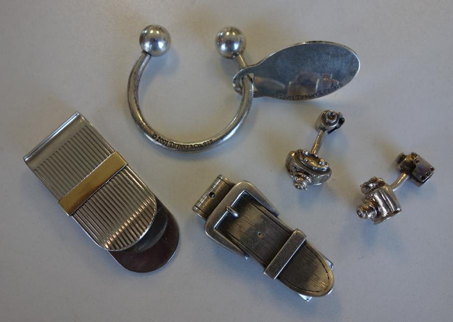 Tiffany Sterling Key Ring, Money Clips & Cufflinks: Tiffany & Co sterling key ring with name tag (monogrammed on one side). Together with a sterling belt buckle formed money clip and a stainless steel money clip by Inox, Italy set with an 18K gold ingo