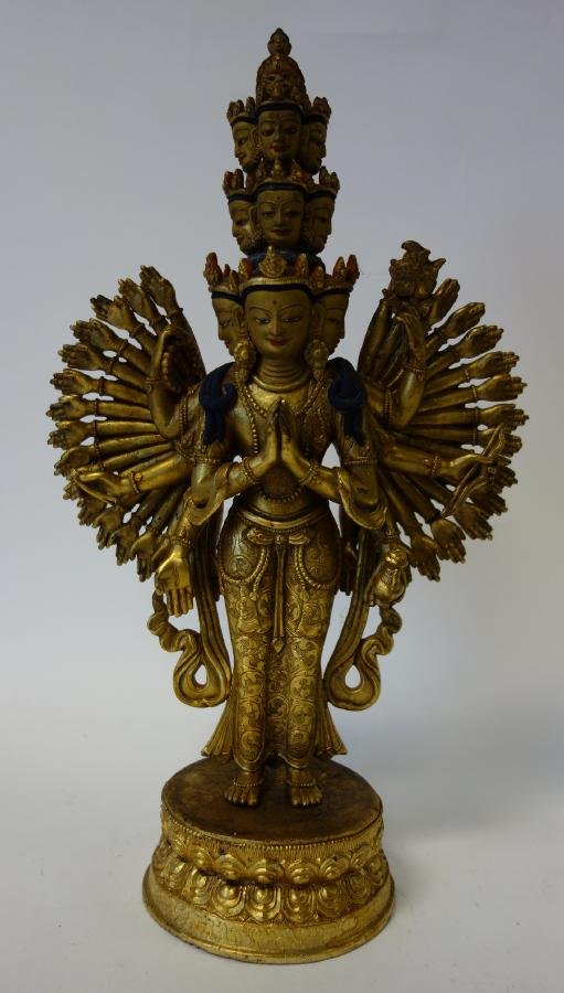Hindu Nepal Bronze of a Female Goddess: Gilt bronze figure of a Hindu multi-armed and multi-headed goddess. c.1900. Nepal. Measures 13.75" high and 8.5" wide.
