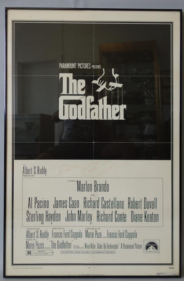 The Godfather Signed Movie Poster, One Sheet: Framed one sheet poster from the movie The Godfather. Signed by Robert Duvall. Framed measurement 41.5" x 27.25". Has not been examined outside of frame.