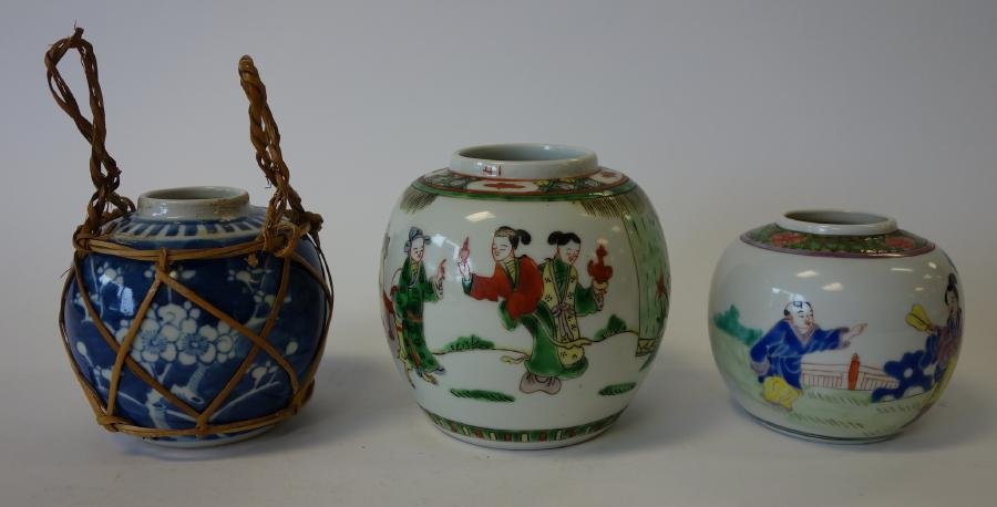 3 Chinese Porcelain Enamel Ginger Jars: 3 Chinese porcelain ginger jars. Two ginger jars with famille rose and verte enamels depicting scenes from mandarin life. Together with an underglaze blue jar with basket-weave holder and handles. Mea